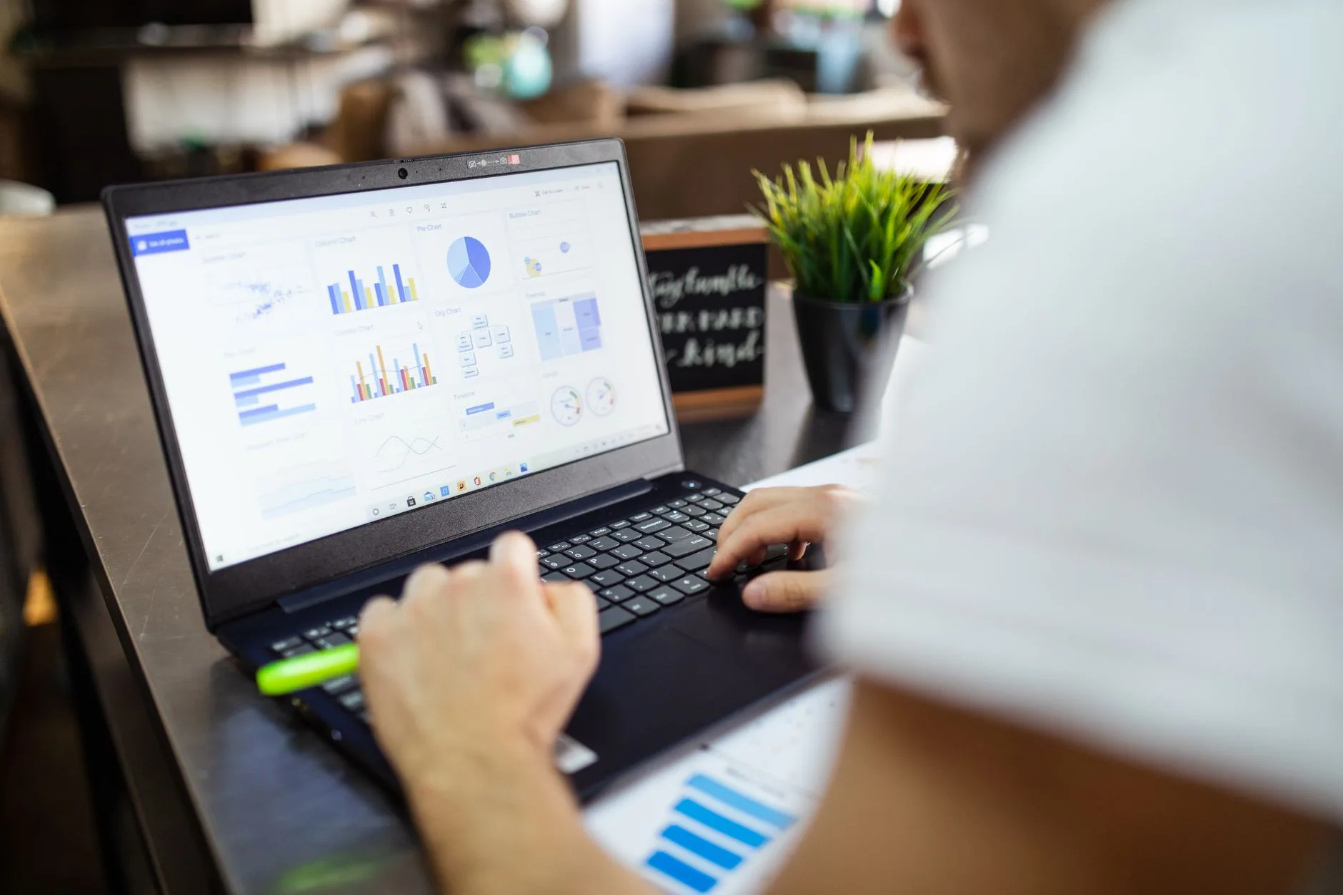 content auditor reviewing performance metrics on a portable computer